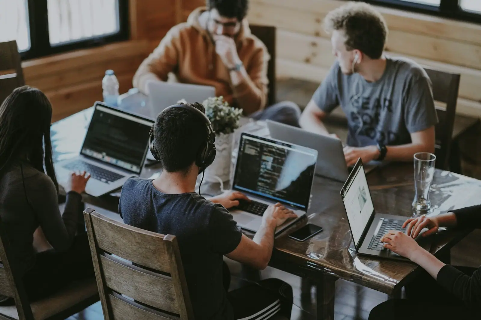 Technology team collaborating around a workstation