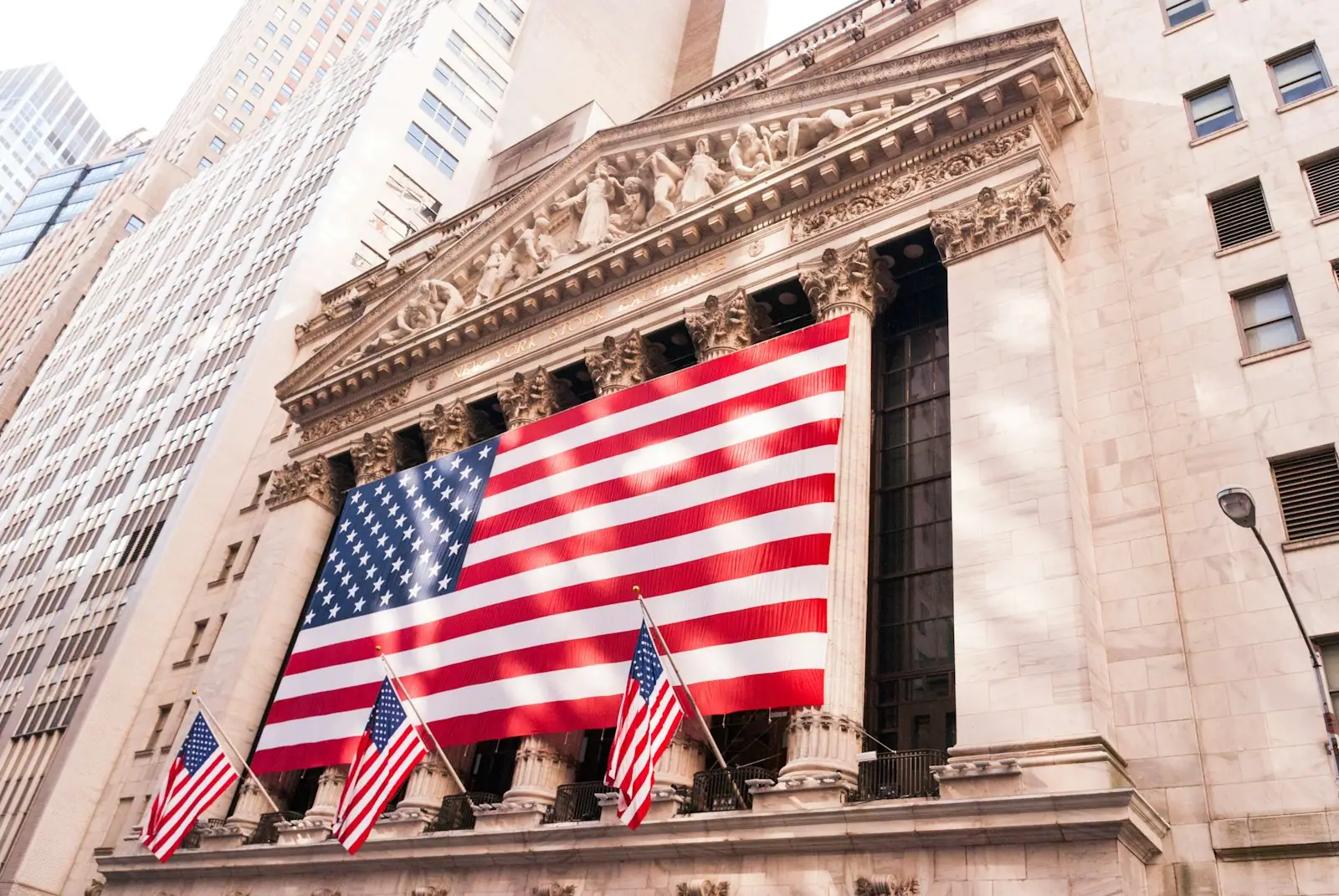 Financial analysts reviewing market data across multiple screens