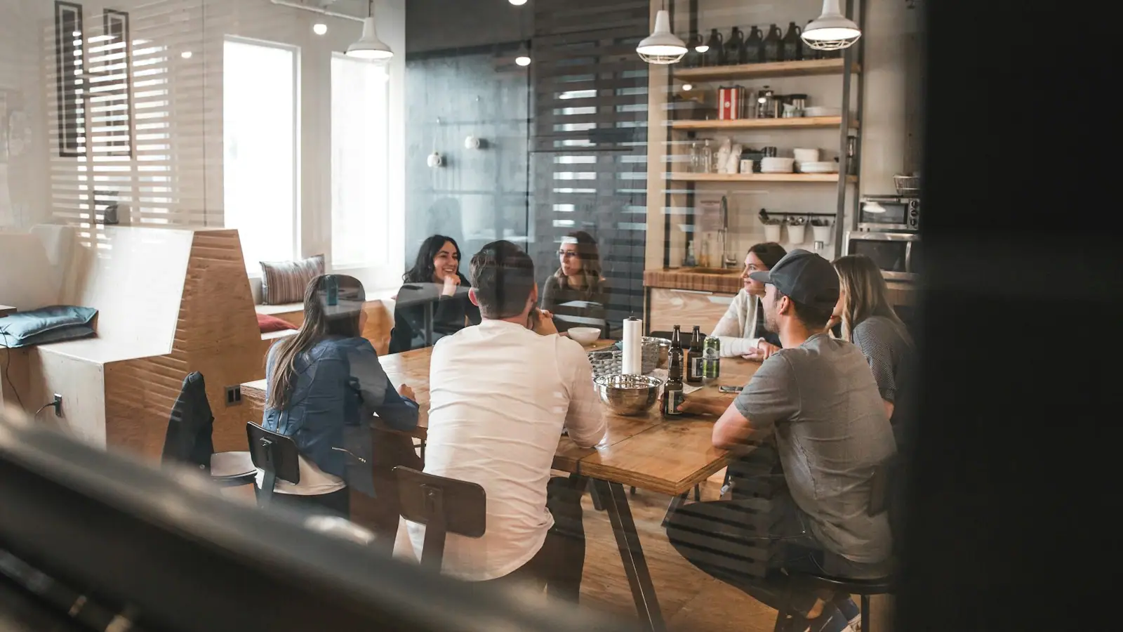 Technology delivery team collaborating in an open office workspace
