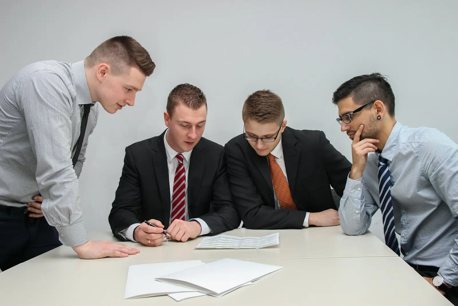 Delivery manager discussing team structure with colleagues