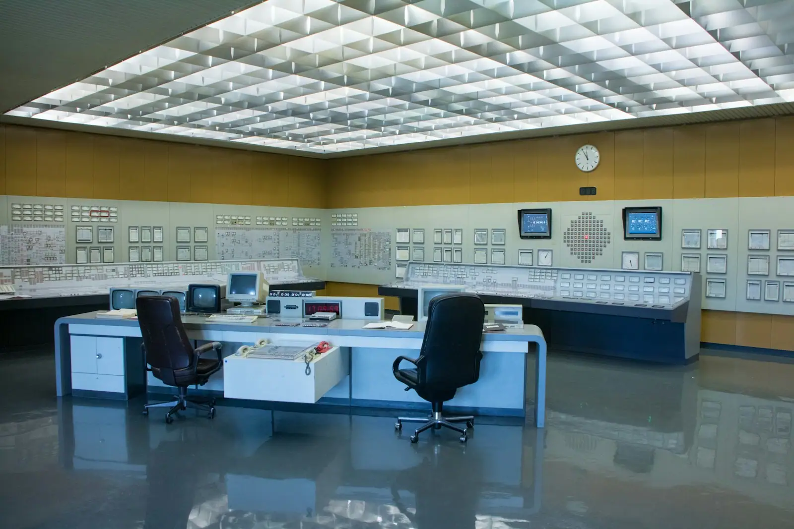 Network operations centre with engineers monitoring application dashboards